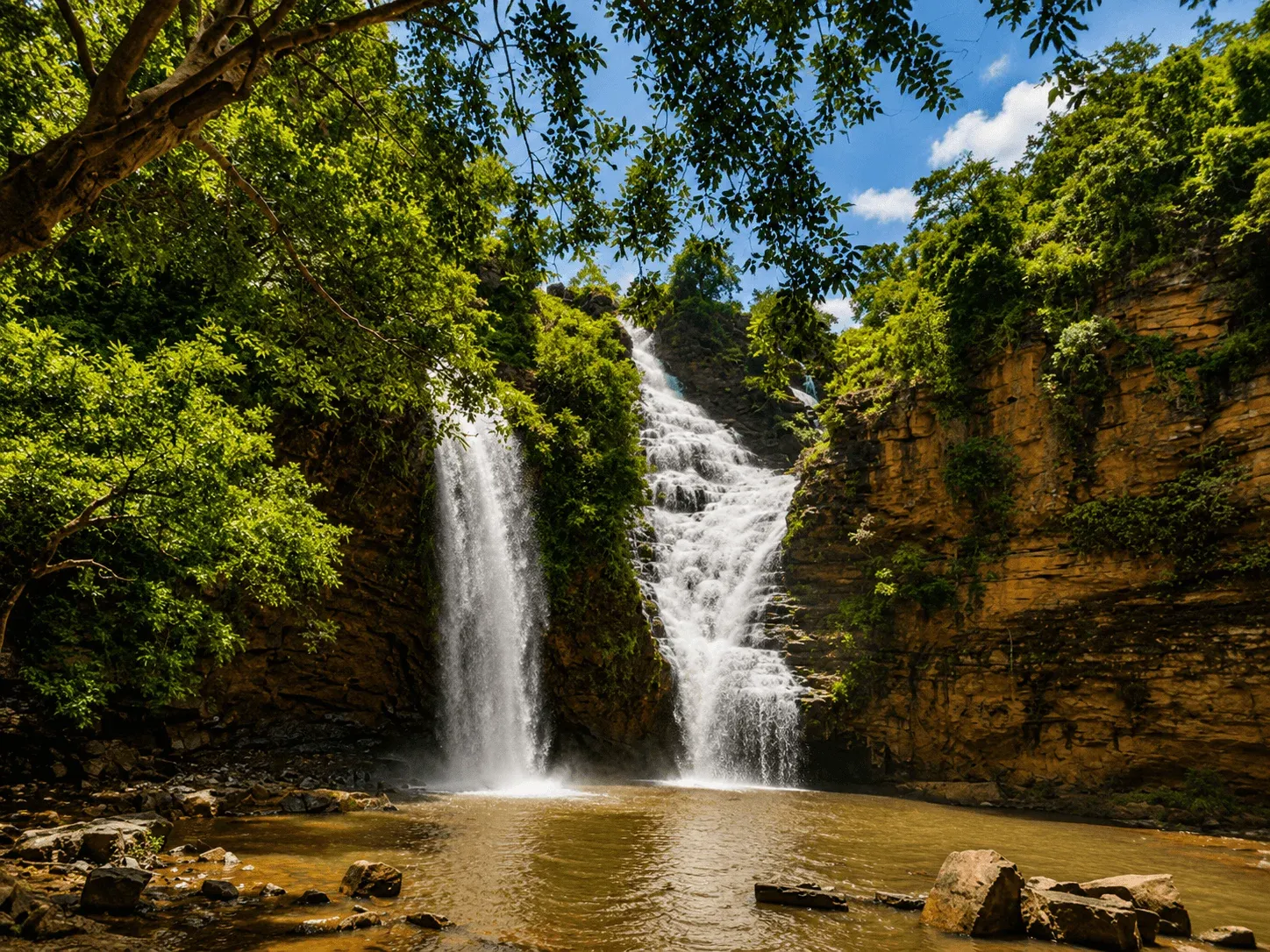 Natural pool at the base of Tirathgarh Falls